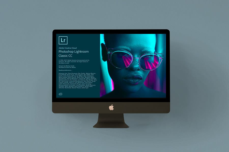 Écran d'iMac affichant Adobe Photoshop Lightroom Classic CC avec une photo néon stylisée en arrière-plan.